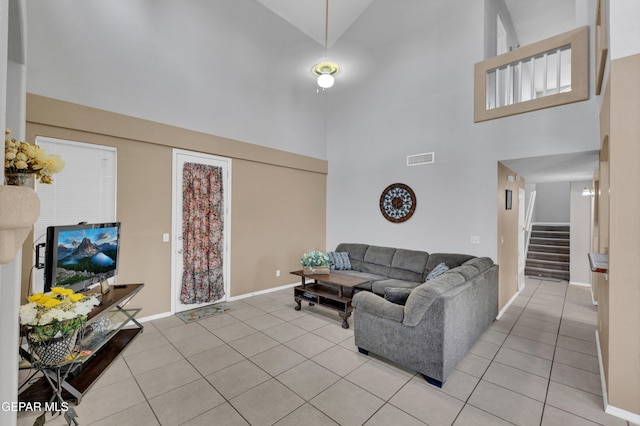 444 Ghost Flower St, Horizon City, TX 79928 - living area featuring a high ceiling, light tile patterned flooring, and stairs
