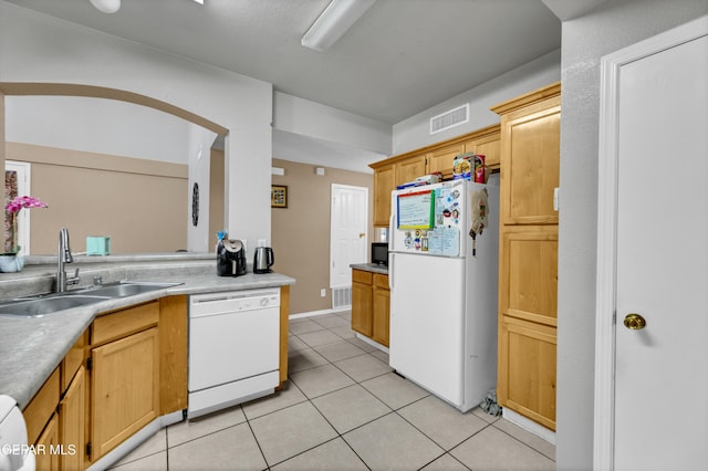444 Ghost Flower St, Horizon City, TX 79928 - kitchen featuring white appliances, light tile patterned floors, and light countertops