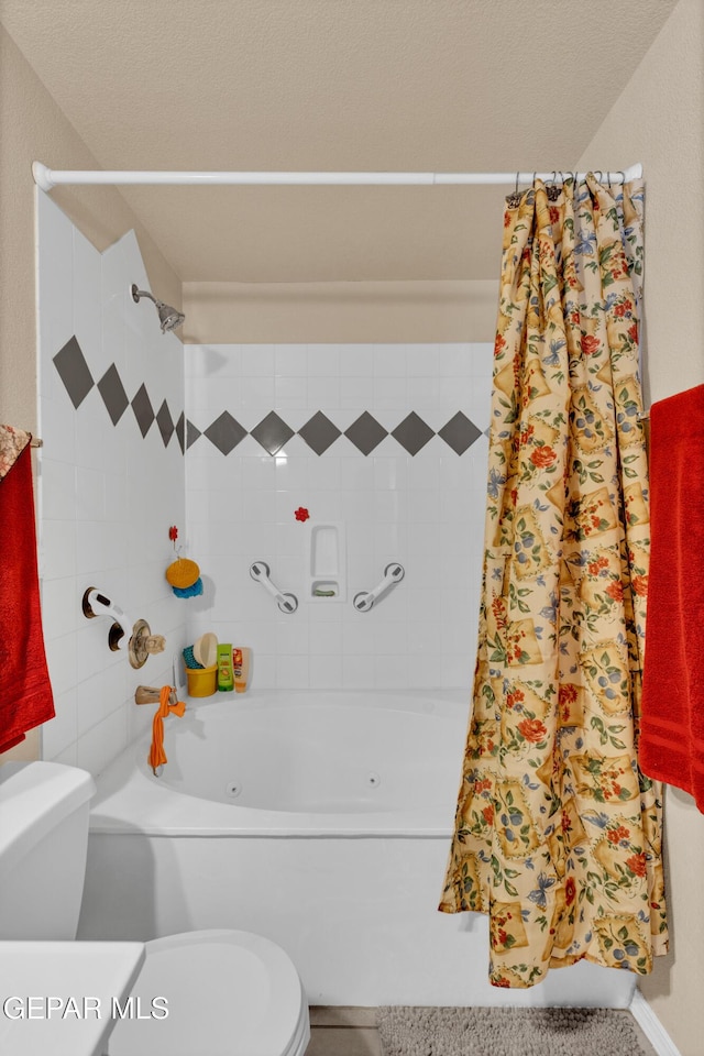 444 Ghost Flower St, Horizon City, TX 79928 - bathroom featuring a combined bath / shower with jetted tub and toilet