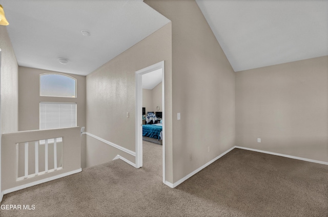 444 Ghost Flower St, Horizon City, TX 79928 - hallway with carpet flooring, lofted ceiling, and an upstairs landing