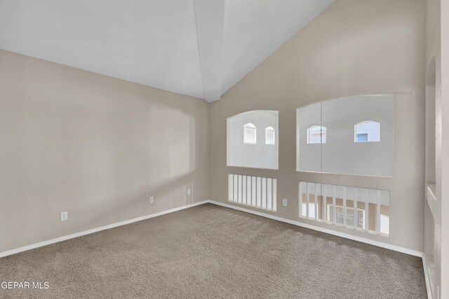 444 Ghost Flower St, Horizon City, TX 79928 - empty room with carpet flooring and high vaulted ceiling