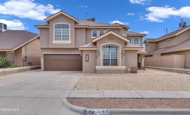 12416 Paseo Largo Cir, El Paso, TX 79928 - view of front of property with stucco siding, driveway, an attached garage, and a shingled roof