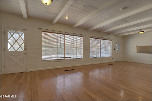 5140 Camino De La Vista Dr, El Paso, TX 79932 - entrance foyer with baseboards, light wood-style floors, beam ceiling, and brick wall