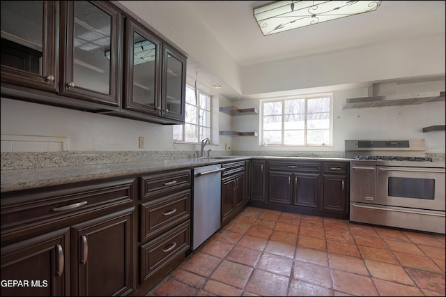 5140 Camino De La Vista Dr, El Paso, TX 79932 - kitchen featuring stainless steel appliances, open shelves, wall chimney range hood, a sink, and dark brown cabinets