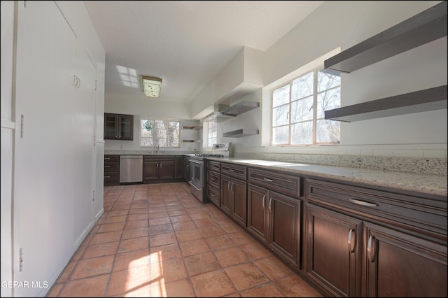 5140 Camino De La Vista Dr, El Paso, TX 79932 - kitchen with open shelves, stainless steel appliances, healthy amount of natural light, and a sink