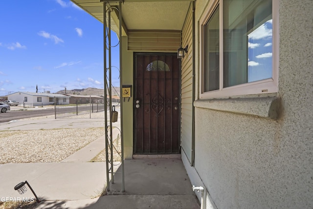 4745 Sierra Madre Dr, El Paso, TX 79904 - doorway to property with a gate and a residential view
