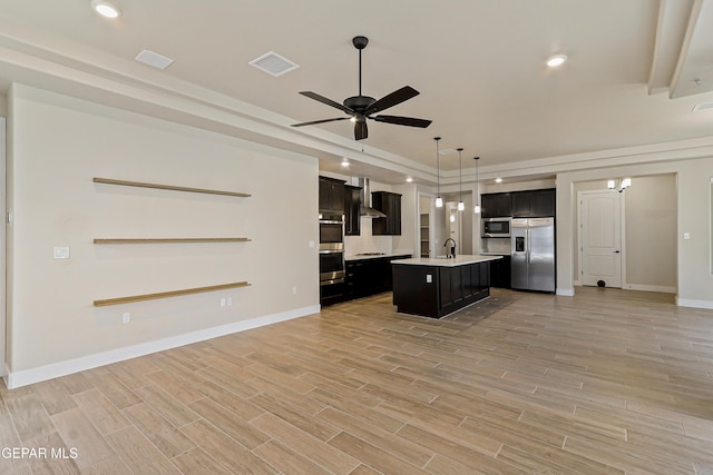 2352 Kolt Ct, El Paso, TX 79911 - kitchen featuring stainless steel appliances, open floor plan, light countertops, a ceiling fan, and a kitchen island with sink