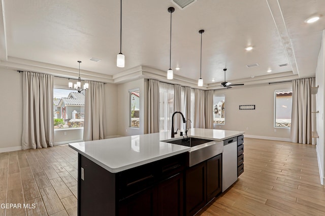 2352 Kolt Ct, El Paso, TX 79911 - kitchen featuring a raised ceiling, a sink, baseboards, light wood-type flooring, and recessed lighting