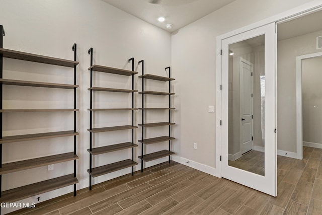 2352 Kolt Ct, El Paso, TX 79911 - unfurnished bedroom with dark wood-style floors and baseboards
