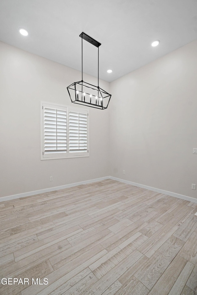 13368 Coldham St, El Paso, TX 79928 - spare room featuring light wood-style floors, a chandelier, baseboards, and recessed lighting