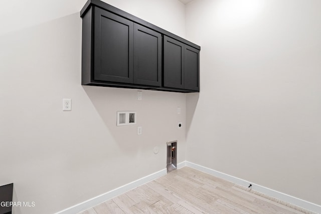 13368 Coldham St, El Paso, TX 79928 - laundry area with electric dryer hookup, hookup for a gas dryer, light wood-type flooring, cabinet space, and washer hookup