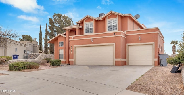 6800 Canyon Run Dr, El Paso, TX 79912 - view of front of house featuring concrete driveway, stucco siding, and a garage