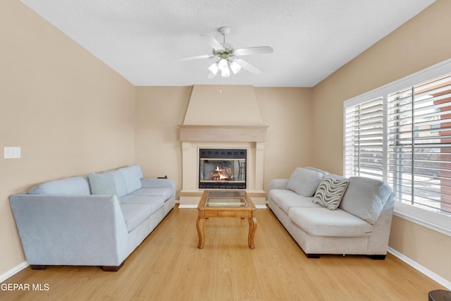 6800 Canyon Run Dr, El Paso, TX 79912 - living area with light wood-style floors, ceiling fan, and baseboards