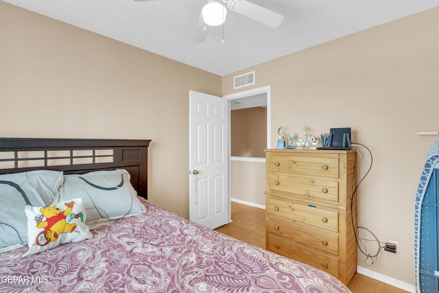 6800 Canyon Run Dr, El Paso, TX 79912 - bedroom with wood finished floors, baseboards, and a ceiling fan