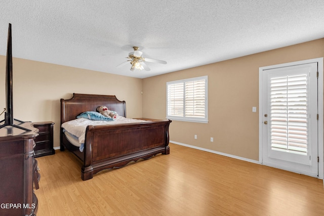 6800 Canyon Run Dr, El Paso, TX 79912 - bedroom featuring light wood-type flooring, a textured ceiling, baseboards, and ceiling fan