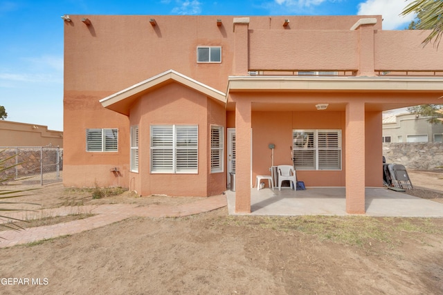 6800 Canyon Run Dr, El Paso, TX 79912 - rear view of house with a patio and stucco siding