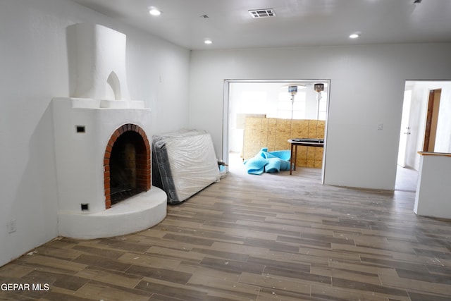 11110 Westside Rd, Anthony, NM 88021 - unfurnished living room with wood finished floors, recessed lighting, and a fireplace
