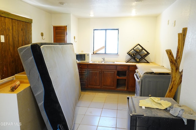 11110 Westside Rd, Anthony, NM 88021 - kitchen featuring white appliances, light tile patterned flooring, and light countertops