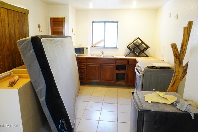 11110 Westside Rd, Anthony, NM 88021 - kitchen with white appliances and light tile patterned floors