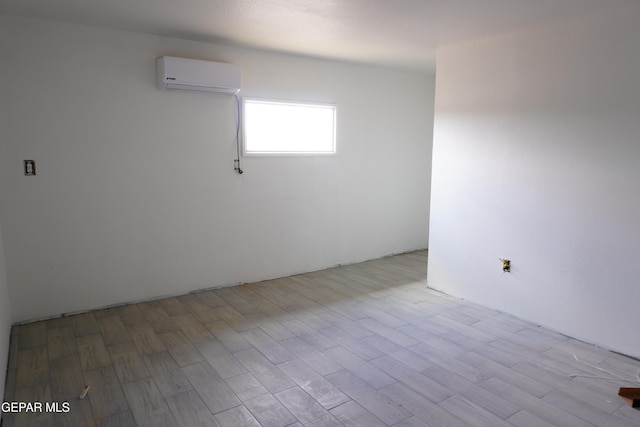 11110 Westside Rd, Anthony, NM 88021 - empty room with a wall unit AC and wood finished floors