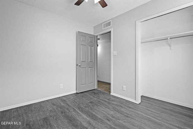 2849 Sinking Rock Pl, El Paso, TX 79938 - unfurnished bedroom featuring dark wood finished floors, a textured ceiling, a closet, baseboards, and a ceiling fan