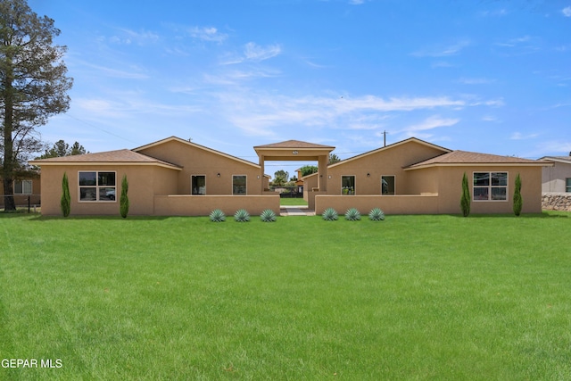 628 Milo Dr, El Paso, TX 79927 - rear view of property featuring a lawn and stucco siding