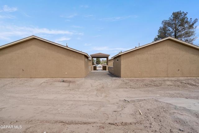 628 Milo Dr, El Paso, TX 79927 - view of side of property featuring stucco siding
