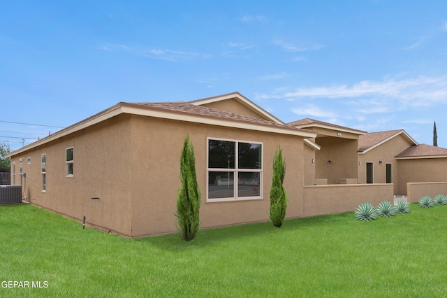 628 Milo Dr, El Paso, TX 79927 - view of side of home with central AC unit, stucco siding, and a shingled roof