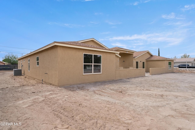 628 Milo Dr, El Paso, TX 79927 - view of home's exterior featuring central AC unit and stucco siding