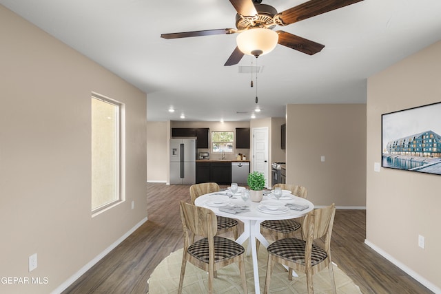 628 Milo Dr, El Paso, TX 79927 - dining room with wood finished floors, baseboards, a ceiling fan, and recessed lighting