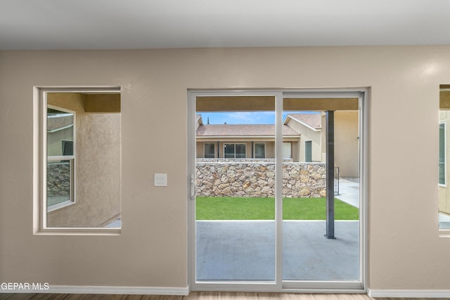 628 Milo Dr, El Paso, TX 79927 - doorway to outside with baseboards