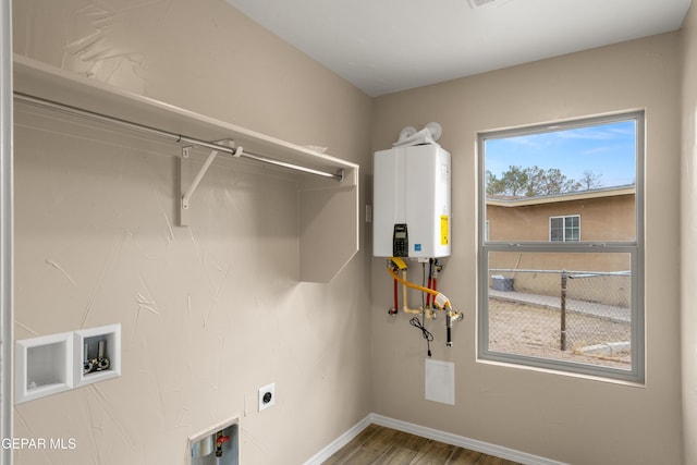 628 Milo Dr, El Paso, TX 79927 - washroom featuring water heater, electric dryer hookup, wood finished floors, baseboards, and washer hookup