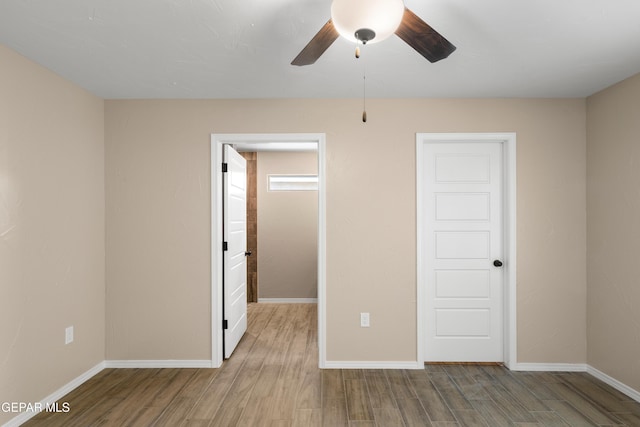628 Milo Dr, El Paso, TX 79927 - unfurnished bedroom with wood finished floors, baseboards, and ceiling fan