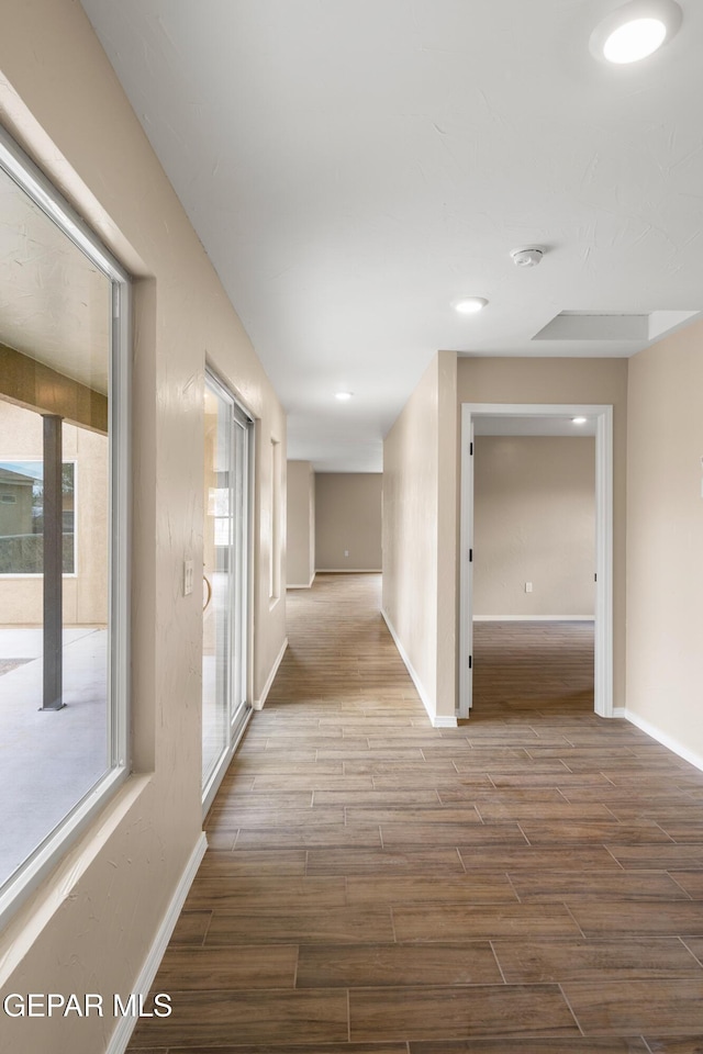 628 Milo Dr, El Paso, TX 79927 - hall featuring wood finished floors, baseboards, healthy amount of natural light, and recessed lighting