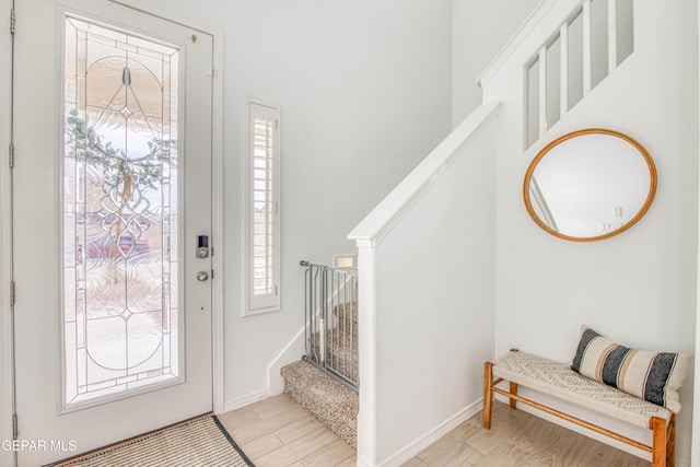 7517 Red Cedar Dr, El Paso, TX 79911 - foyer featuring stairs, light wood-style floors, and baseboards
