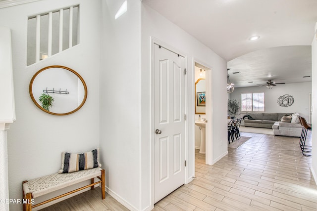7517 Red Cedar Dr, El Paso, TX 79911 - hallway with light wood-style floors, baseboards, and recessed lighting