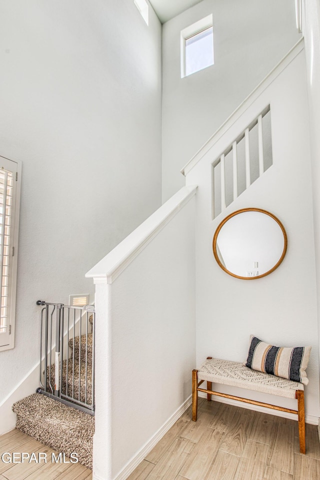 7517 Red Cedar Dr, El Paso, TX 79911 - stairs featuring wood finished floors and baseboards