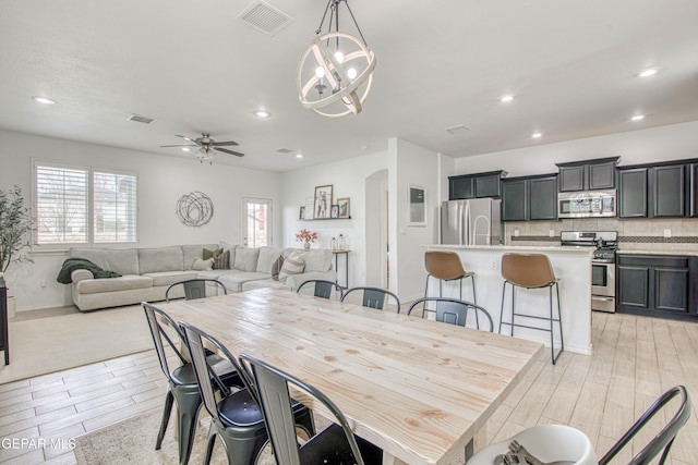 7517 Red Cedar Dr, El Paso, TX 79911 - dining space with plenty of natural light, light wood-type flooring, a chandelier, ceiling fan, and recessed lighting