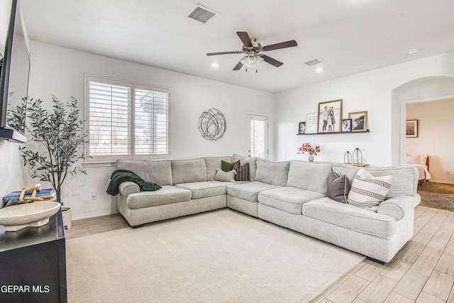 7517 Red Cedar Dr, El Paso, TX 79911 - living room featuring wood finished floors, a ceiling fan, arched walkways, baseboards, and recessed lighting