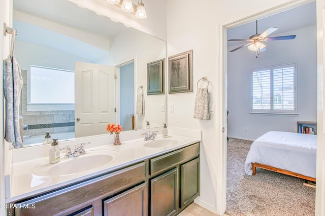 7517 Red Cedar Dr, El Paso, TX 79911 - ensuite bathroom featuring double vanity, a ceiling fan, a bath, and baseboards