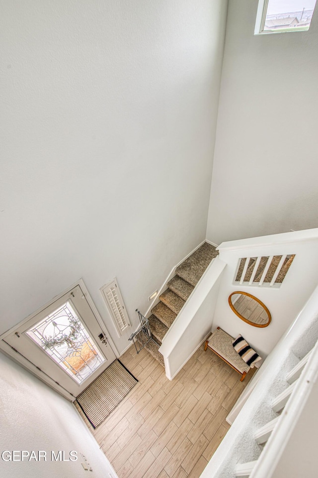 7517 Red Cedar Dr, El Paso, TX 79911 - stairs featuring wood finished floors