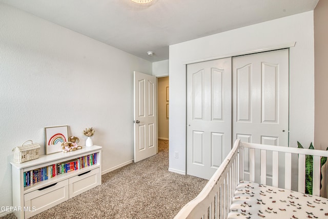 7517 Red Cedar Dr, El Paso, TX 79911 - carpeted bedroom with a closet, baseboards, and a crib