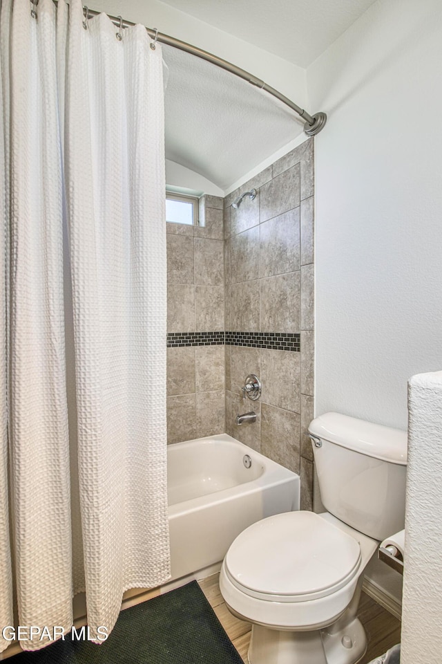 7517 Red Cedar Dr, El Paso, TX 79911 - full bathroom with toilet, shower / bath combination with curtain, wood finished floors, and vaulted ceiling