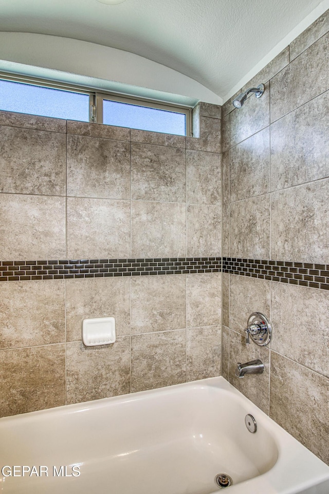 7517 Red Cedar Dr, El Paso, TX 79911 - full bathroom featuring tub / shower combination and lofted ceiling