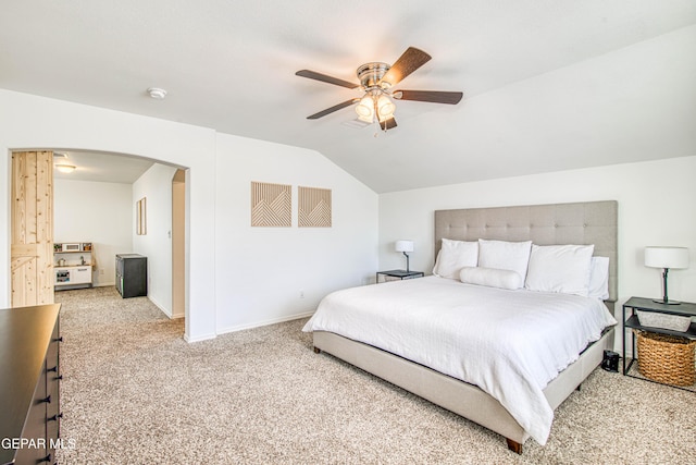 7517 Red Cedar Dr, El Paso, TX 79911 - carpeted bedroom featuring arched walkways, lofted ceiling, baseboards, and a ceiling fan
