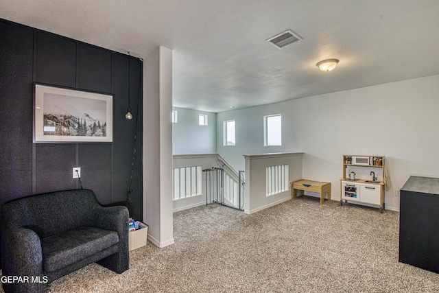 7517 Red Cedar Dr, El Paso, TX 79911 - sitting room with light colored carpet, an upstairs landing, and baseboards