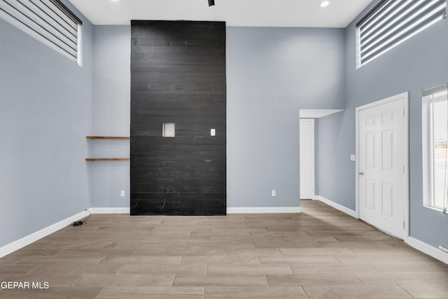 3899 Vanderveer Dr Unit A B C, El Paso, TX 79938 - entrance foyer with baseboards, wood tiled floors, a high ceiling, and recessed lighting