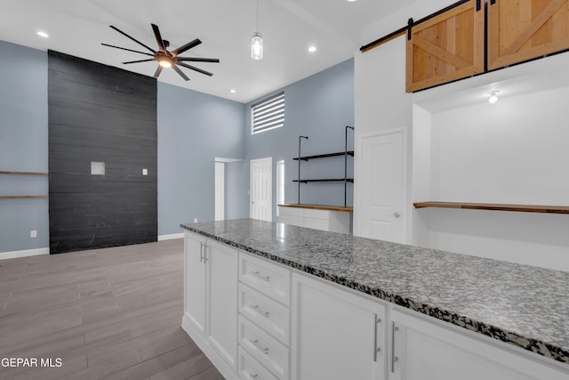 3899 Vanderveer Dr Unit A B C, El Paso, TX 79938 - kitchen featuring a ceiling fan, baseboards, white cabinets, dark stone counters, and recessed lighting