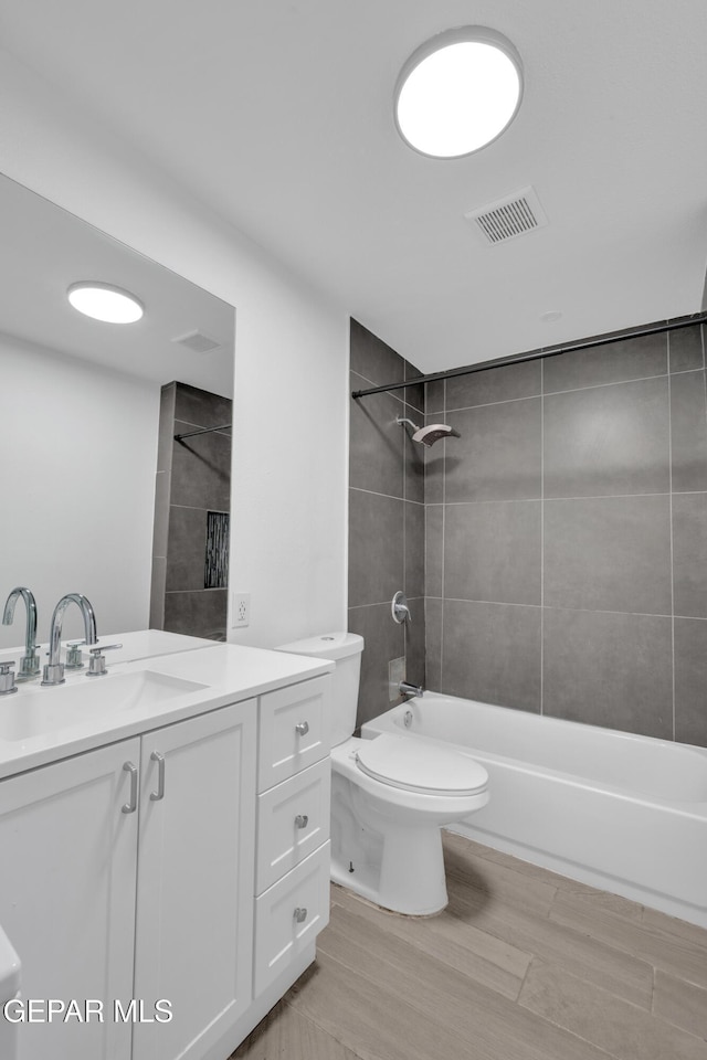 3899 Vanderveer Dr Unit A B C, El Paso, TX 79938 - bathroom with vanity, toilet, shower / bathtub combination, and wood finished floors
