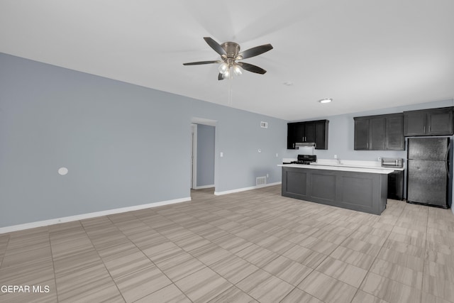3899 Vanderveer Dr Unit A B C, El Paso, TX 79938 - kitchen featuring freestanding refrigerator, light countertops, ceiling fan, baseboards, and open floor plan